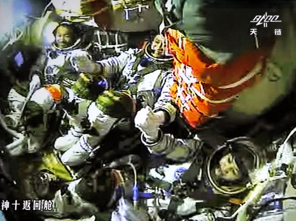 Chinese Astronauts Celebrate Manual Docking Success