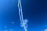 Contrails line the sky over Wallops Island, Va., on July 4, 2013 after two sounding rockets launched 15 seconds apart as part of the Daytime Dynamo experiment. A NASA Black Brant V was launched at 10:31:25 a.m. and was followed 15 seconds later by a Terrier-Improved Orion.