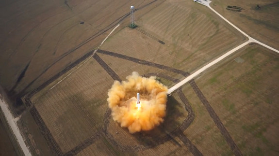 SpaceX's reusable Grasshopper rocket prototype rises skyward from its McGregor, Texas launch pad during a June 14, 2013 test flight that reached 1,066 feet (325 meters) before descending back to Earth. This still was taken from a video recorded by a small unmanned hexacopter.