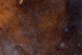 This wide-field view shows a region of sky in the southern constellation of Norma (The Carpenter's Square). At the centre lies the massive star-forming region SDC 335.579-0.292, but this is too obscured by dust to be visible. Image released July 10, 2013.