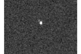 Charon is visible for the first time in pictures taken by the Pluto-bound New Horizons spacecraft. Image released July 10, 2013.
