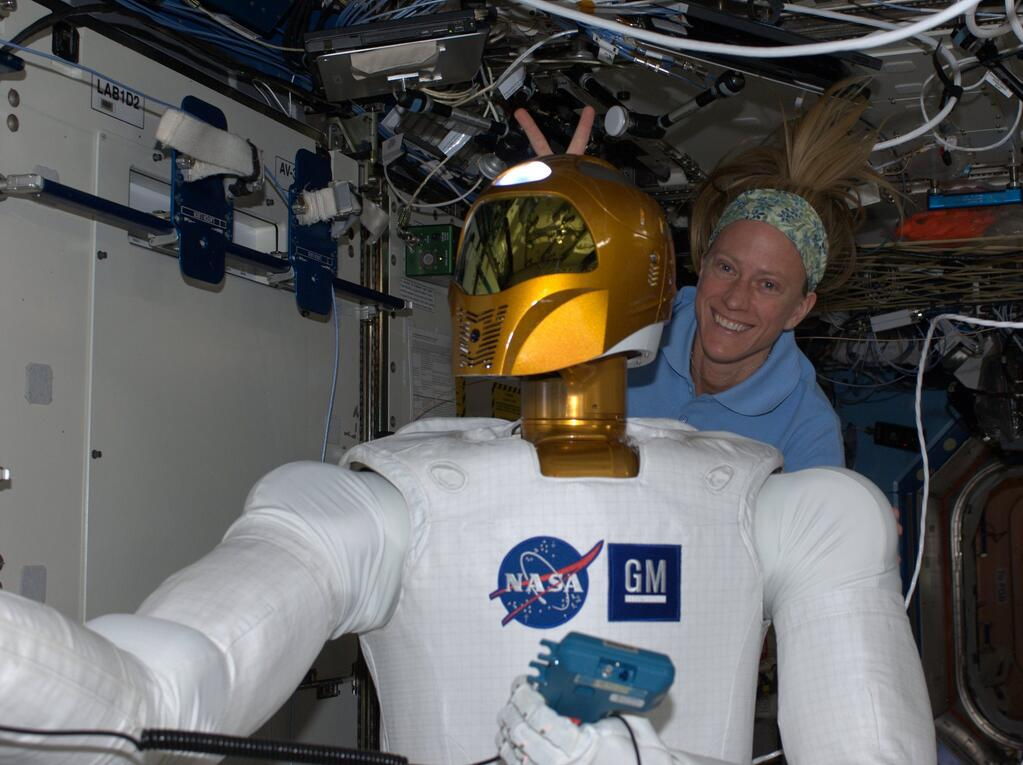 Astronaut Nyberg and Robonaut 2 in a Moment of Levity