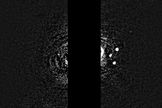 Unannotated image of Neptune's ring arcs and moons. Image released July 15, 2013.