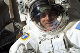 Chris Cassidy works on the International Space Station. A little more than one hour into the spacewalk, Luca Parmitano (out of frame) reported water floating behind his head inside his helmet. This image was released July 16, 2013.