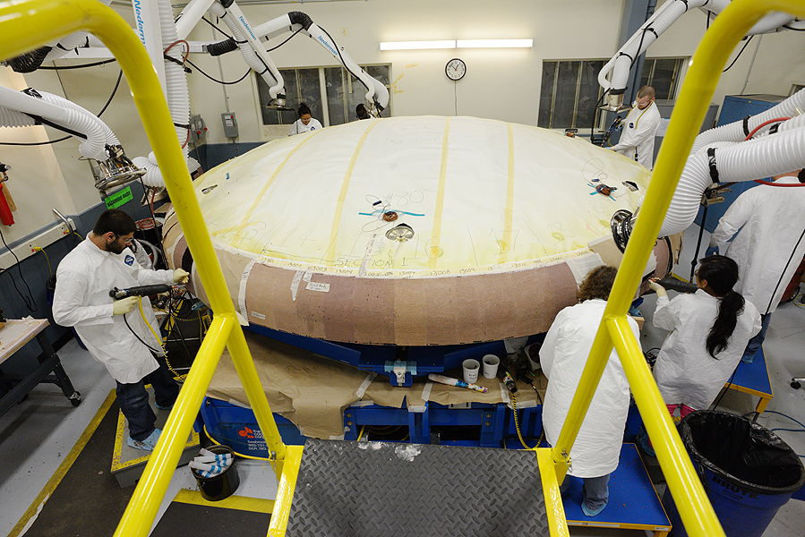Workers with the Heat Shield (Top View)