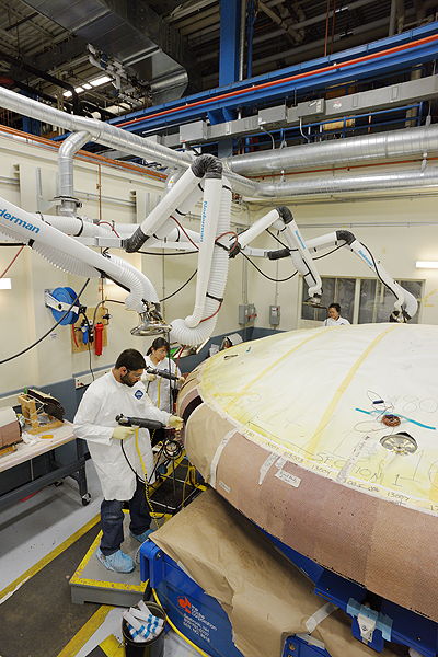 Workers with the Heat Shield (Half View)