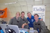 NASA astronaut Mike Fossum poses for a snapshot with the UC San Diego Microgravity Team during a weightless research flight with NASA's Microgravity University on July 19, 2013. The team studied how biofuels burn in zero-gravity conditions.