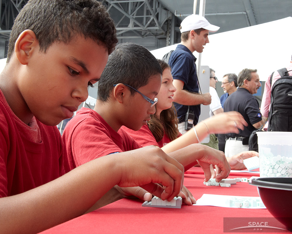 Children Assemble LEGO Tiles for Mosaic