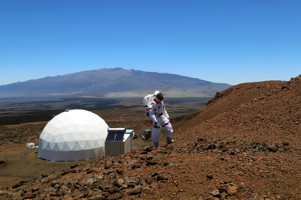 A HI-SEAS Crew Member in a Spacesuit