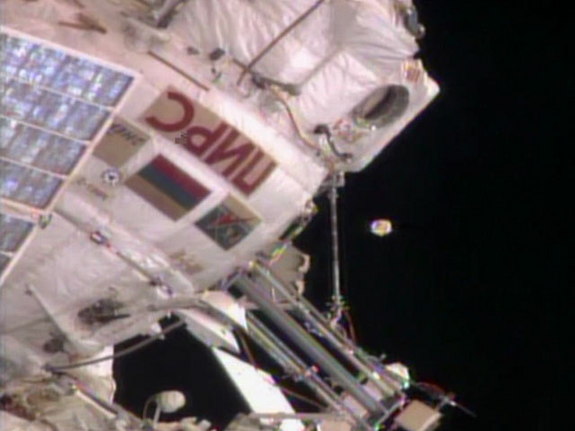 An unidentified object floats near the International Space Station on August 19, 2013. Russian ground controllers later identified it as an antenna cover from the Zvezda service module.