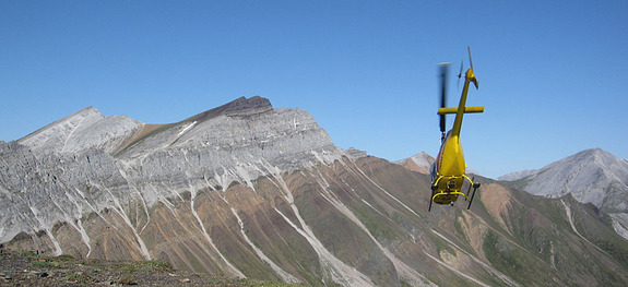 Maroon glacial deposits lay on top of a grey carbonate reef. Though the photo was taken in Canada's Yukon Territory, the land mass lay in the tropics millions of years ago, indicating just how cold the planet got.
