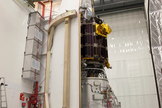 Engineers at NASA's Wallops Flight Facility in Virginia encapsulate NASA's Lunar Atmosphere and Dust Environment Explorer (LADEE) spacecraft into the fairing of the Minotaur V launch vehicle nose-cone.