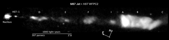 This image from the Hubble Space Telescope shows the giant cosmic jet, a so-called "space slinky," erupting from the giant black hole at the center if the distant galaxy M87. Image released Aug. 22, 2013.
