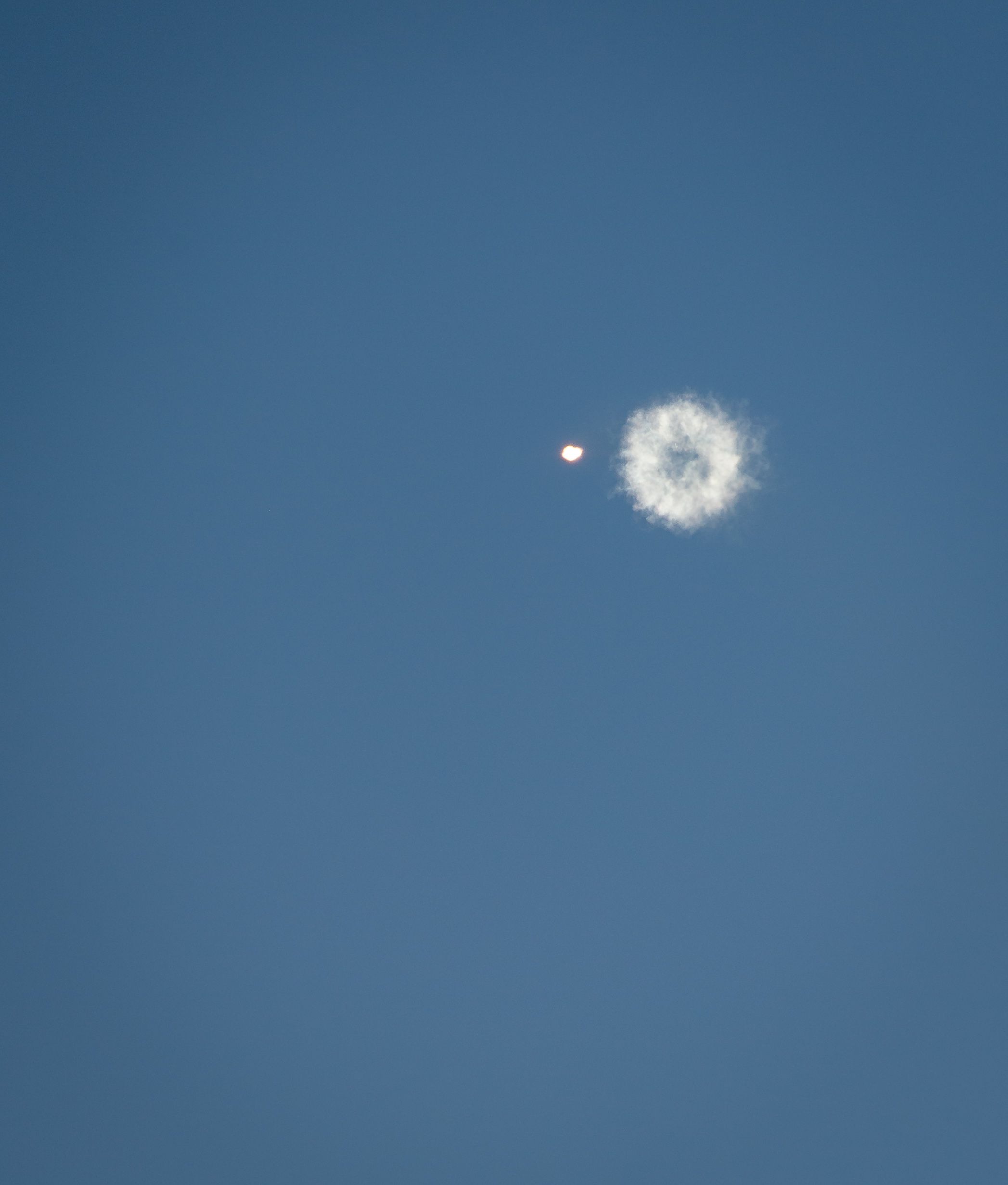 Smoke Ring Follows Receding Antares Rocket After Launch