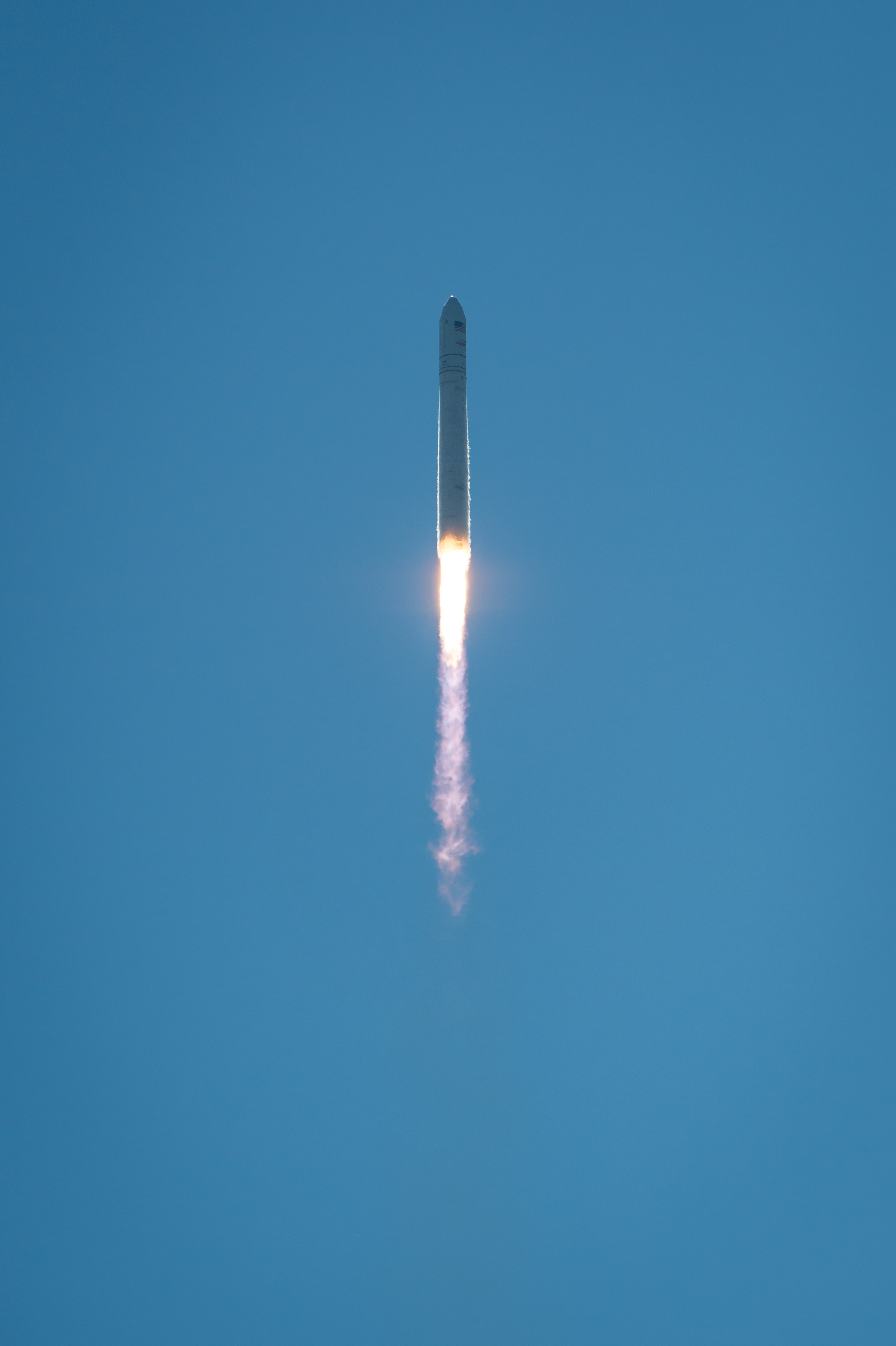 Antares Rocket Soars in Clear Blue Sky
