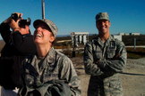 Kaylee Ausbun, the Air Force officer in charge of public affairs for this launch, smiles with relief as SpaceX's improved Falcon 9 rocket departs the launch pad on Sunday. To her left is Jim Spellman of the Western Spaceport chapter of the National Space Society.