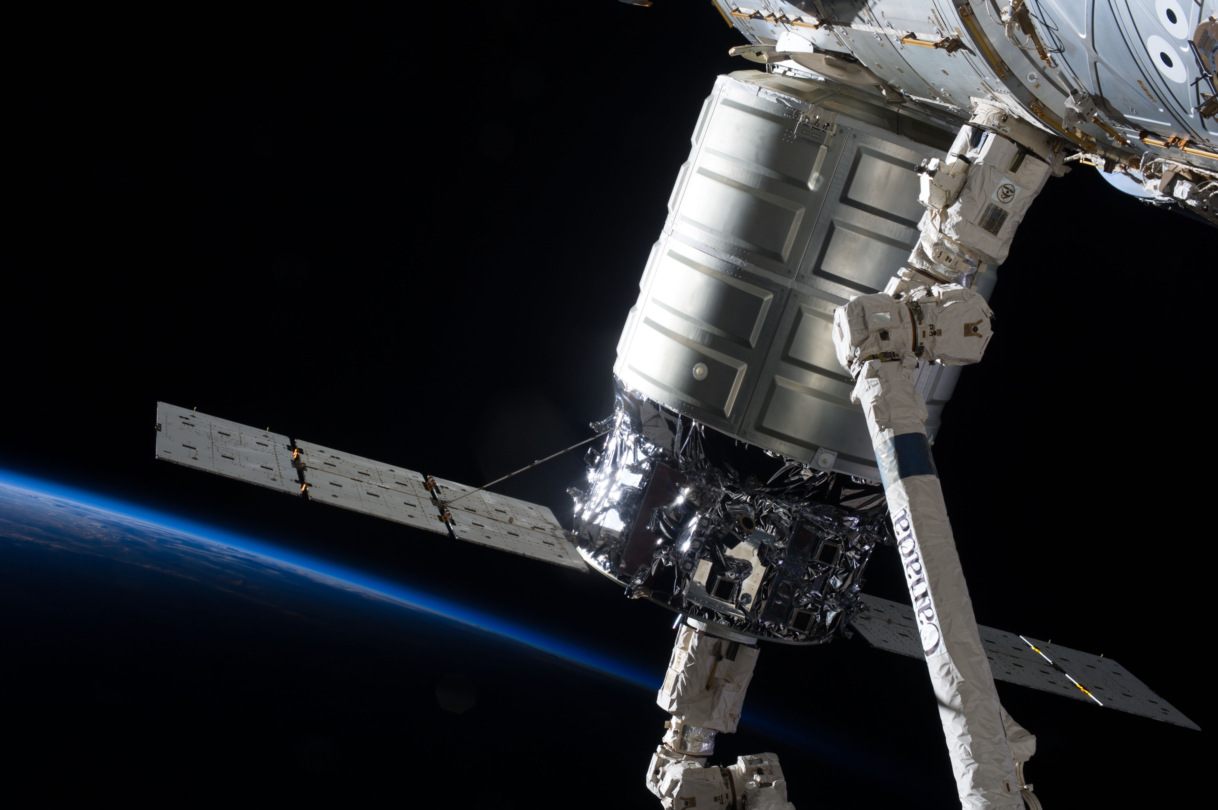 Cygnus Spacecraft at ISS and Earth