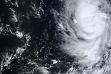 NASA's Terra satellite flew over Raymond on Oct. 20, 2013, at 2 p.m. EDT and saw clouds associated with Raymond's northern quadrant were streaming over mainland Mexico, despite the center being over open water.