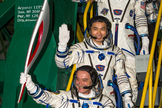 Russian cosmonaut Mikhail Tyurin, Expedition 38 Soyuz commander, holds the Olympic torch as Flight Engineer Koichi Wakata of Japan and Rick Mastracchio of NASA (top) wave farewell prior to boarding the Soyuz TMA-11M rocket for launch, Thursday, Nov. 7, 2013 Local Time, at the Baikonur Cosmodrome in Kazakhstan. The Olympic torch has a four-day visit to the International Space Station.