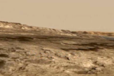 This screenshot from an animated NASA video shows the Murray Buttes, a cluster of steep formations near the base of Mars' Mount Sharp.