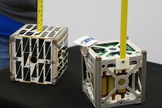 PhoneSat 1.0 (right) and PhoneSat 2.4 both use commercially available smartphones as the brains of the satellites. Photo uploaded Nov. 18, 2013.