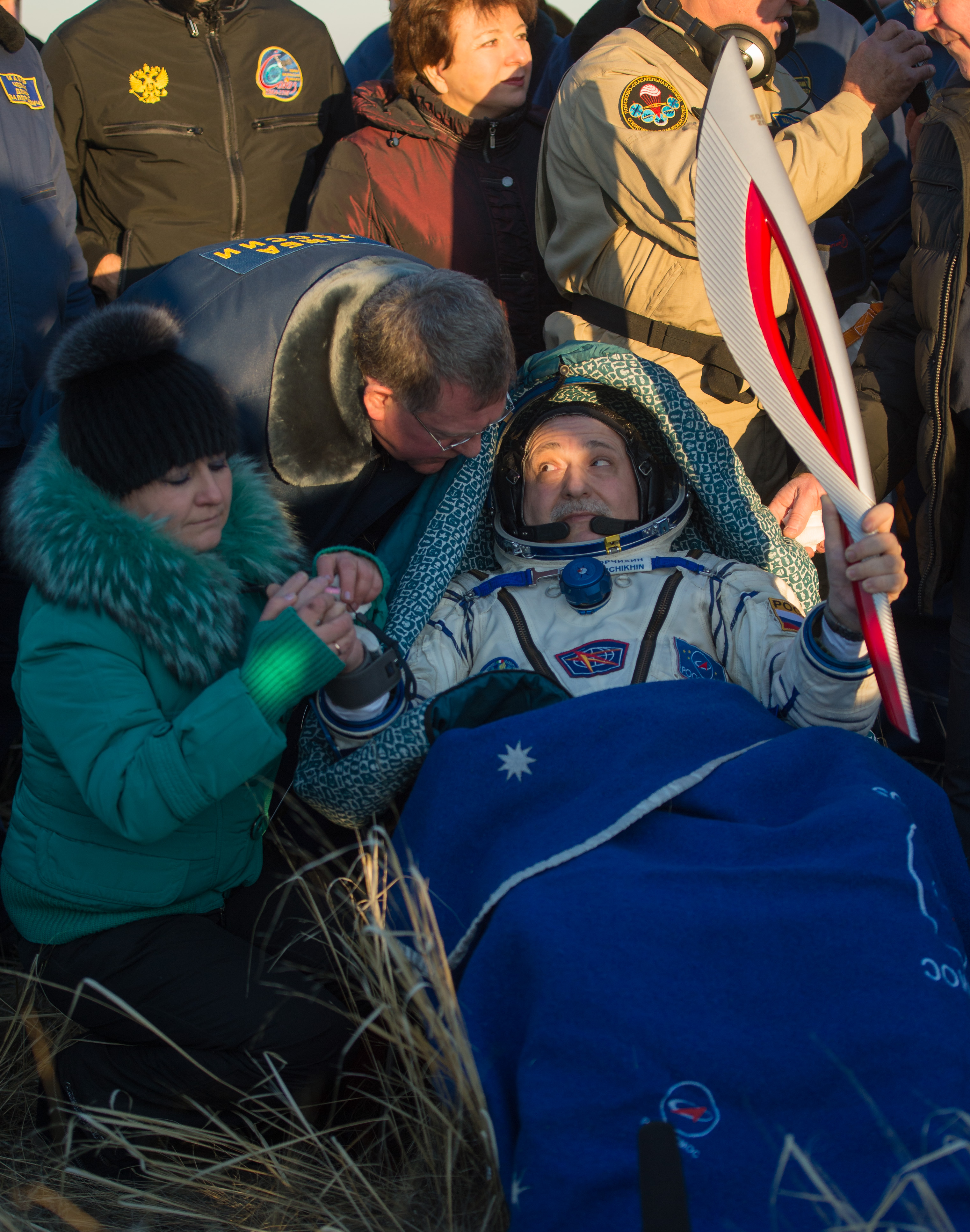 Olympic Torch Back on Earth: Yurchikhin Holds Torch