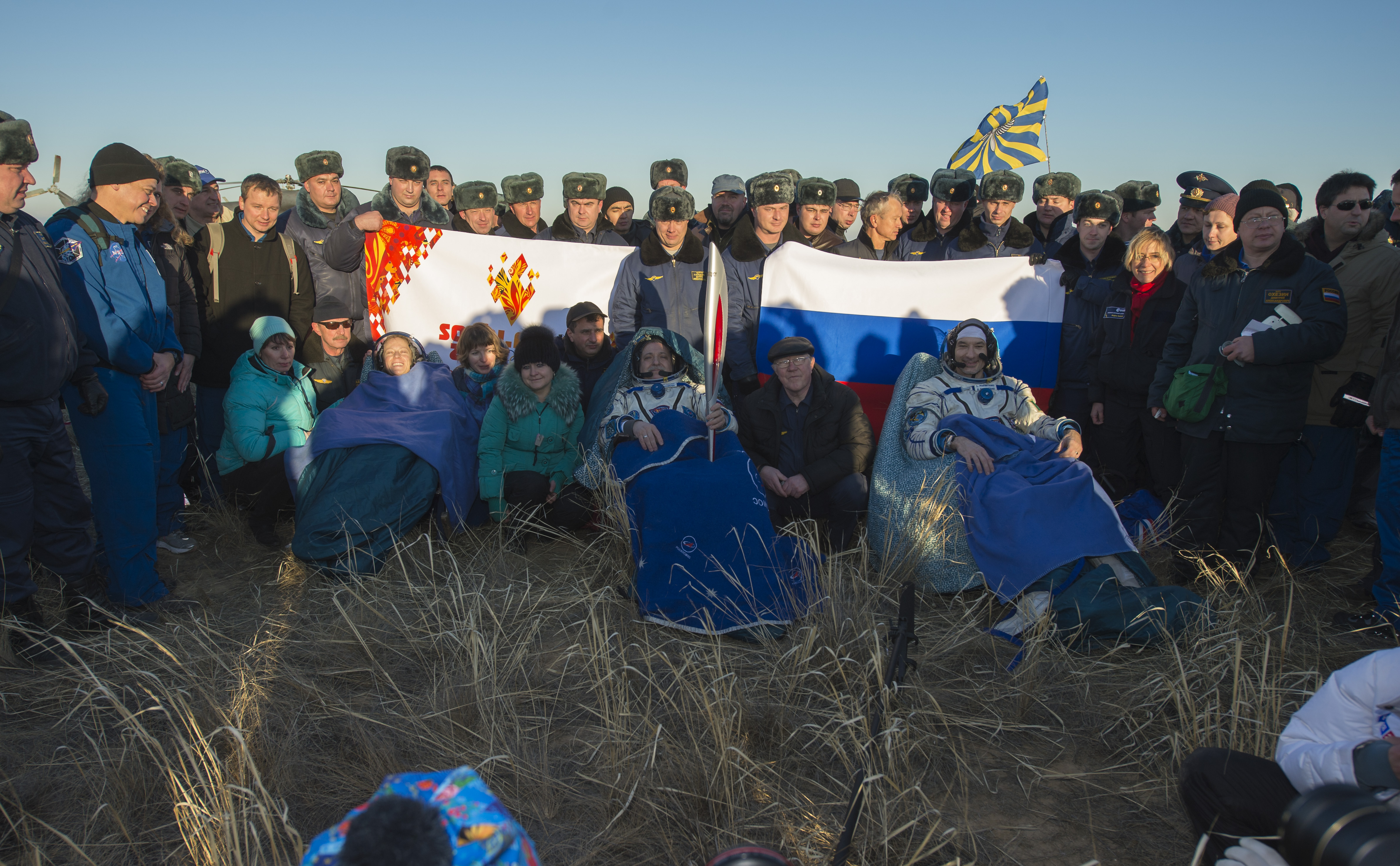 Olympic Torch Back on Earth: Expedition 37 Crew with Torch