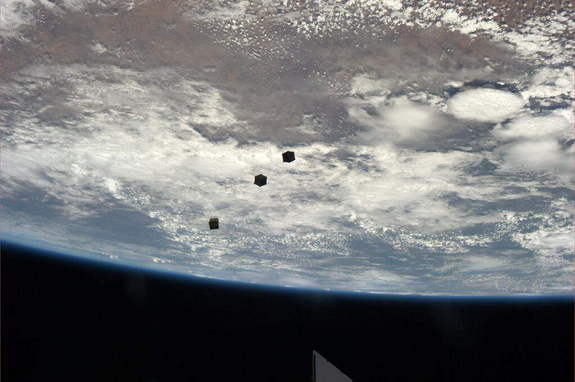 Three small CubeSats float above the Earth after deployment from the International Space Station. Astronaut Rick Mastracchio tweeted the photo from the station on Nov. 19, 2013.