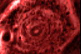 This still image from an infrared movie from NASA's Cassini mission shows the churning of the curious six-sided jet stream at Saturn's north pole known as "the hexagon." The image was obtained on June 14, 2013.