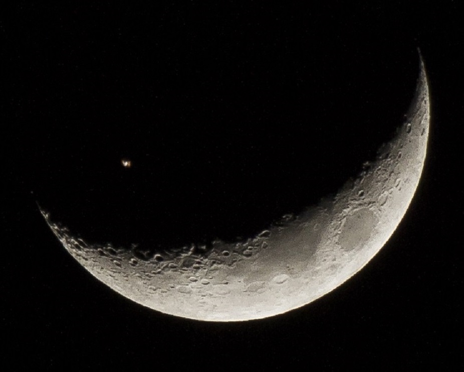 International Space Station Transits Moon by Juan Gonzalez-Alicea
