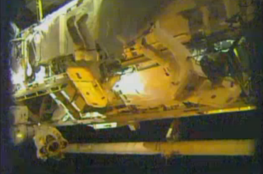 Astronauts Spacewalk Outside Space Station