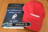 Space reporter Elizabeth Howell plans to bring a book by Chris Hadfield, a "Canada" hat made for the STS-115 mission, and an Apollo 13 keychain on a mock mission to Mars at the Mars Desert Research Station in January 2014.