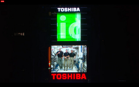 Astronauts on the International Space Station wish Earth a Happy New Year for 2014 in a video message shown in New York City's Times Square during the New Year's Eve bash on Dec. 31, 2013. From left, they are: Rick Mastracchio and Mike Hopkins, both of NASA, and Koichi Wakata of Japan.