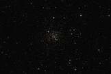 The Messier 67 star cluster shines in the center of this image. The star cluster plays host to about 500 stars that are all around the same age and composition as the sun. Image released Jan. 15, 2014.