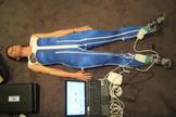 This high-tech "skinsuit" for astronauts is a tailor-made overall with a bi-directional weave specially designed to counteract the lack of gravity. Here, the force the suit is producing is being measured at the feet with a computer using force transducers in the soles of the footwear.