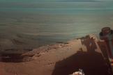 NASA's Mars Rover Opportunity catches its own late-afternoon shadow in this dramatically lit view eastward across Endeavour Crater on Mars. Most of the component images were recorded during the 2,888th Martian day, or sol, of Opportunity's work on Mars (March 9, 2012).