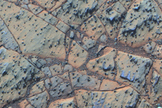 Pancam false-color image acquired on sol 3208 of Matijevic formation rocks at the Whitewater Lake locality, showing embedded spherules. Approximate scale across image is 40 cm.