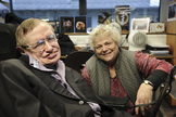 Stephen Hawking and his assistant Judith Croasdell pose for a portrait in his office at the Department of Applied Mathematics and Theoretical Physics, Cambridge. Hawking is the subject of the PBS documentary "Hawking" airing Jan. 29, 2014, as well as the biopic "The Theory of Everything," set for theatrical release on Nov. 7, 2014.