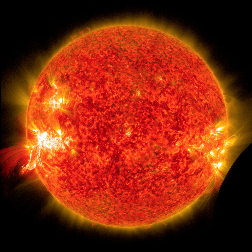 NASA's Solar Dynamics Observatory Sees a Solar Flare and a Lunar Transit
