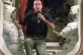 NASA astronaut Rick Mastracchio speaks with Space.com from the International Space Station while flanked by two U.S. spacesuits. Image uploaded Jan. 31, 2014.