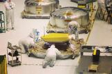 One of the last three flight primary mirror segments of the James Webb Space Telescope are inspected after delivery to NASA Goddard.