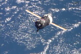 The Russian Progress 54 cargo ship approaches the International Space Station with the Earth in the background on Feb. 5, 2014.