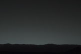 This view of the twilight sky and Martian horizon taken by NASA's Curiosity Mars rover includes Earth as the brightest point of light in the night sky. Earth is a little left of center in the image, and our moon is just below Earth. The Curiosity rover snapped the photo on Jan. 31, 2014.