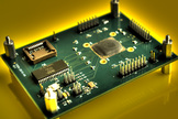 This is a close-up of the housekeeping chip that was bonded onto an electronics board as part of an investigation into the effectiveness of 3-D manufacturing for electronics applications.