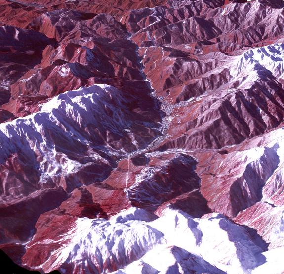 The 2014 Winter Olympic ski runs may be rated double black diamond, but they're not quite as steep as they appear in this image of the skiing and snowboarding sites for the Sochi Winter Olympic Games, acquired on Jan. 4, 2014, by NASA's Terra satellite. Rosa Khutar ski resort near Sochi, Russia, is in the valley at center, and the runs are visible on the shadowed slopes on the left-hand side of the valley.