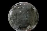 A geologic map of Jupiter's largest moon Ganymede is superimposed over a global color mosaic of the Galilean moon made of images from NASA's Voyager 1, 2 and Galileo spacecraft.