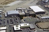 Aerial photo showing the original hangars and administrative buildings that were built in 1954 as they appeared in 2001 at what now will be known as the NASA Armstrong Flight Research Center, redesignated in honor of the late Neil A. Armstrong.