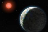 View of the possible inner planets of the Gliese 581 system along with their star, a red dwarf.