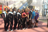Project MERCCURI and Science Cheerleader team members take swab samples from John Glenn's 'Friendship 7' Mercury capsule at the National Air and Space Museum.