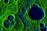 A belt of ridges and scarps stretches 336 mile (540 km) across the surface of Mercury. The colors correspond to elevation, with yellow-green revealing higher spots and blue revealing low.